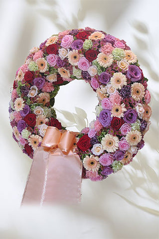 Kranz Milfleur ohne Reisigunterlage mit gemischten Blüten in rosa inkl. Schleife